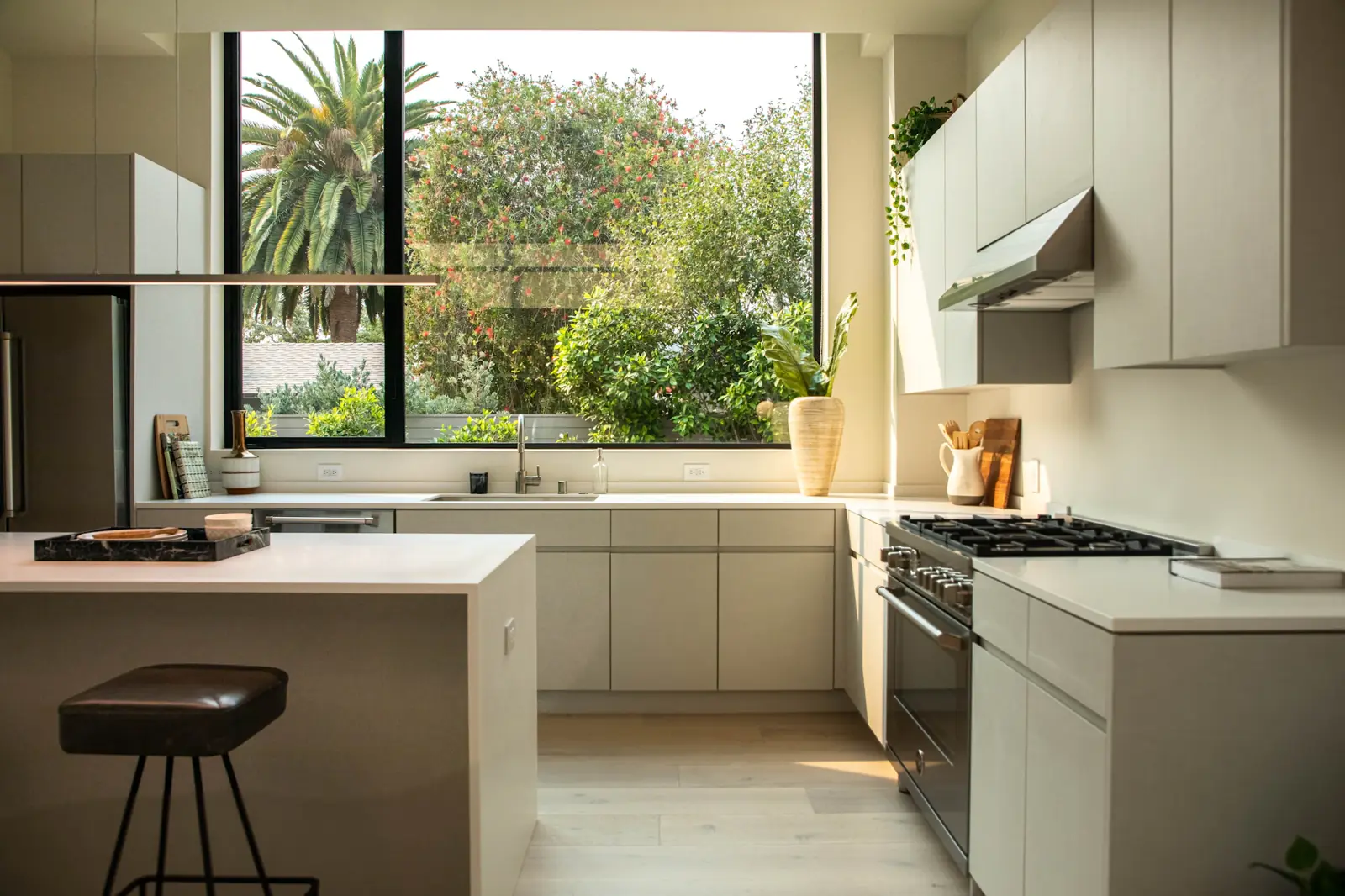 Renovated kitchen with an island bench and a large garden window