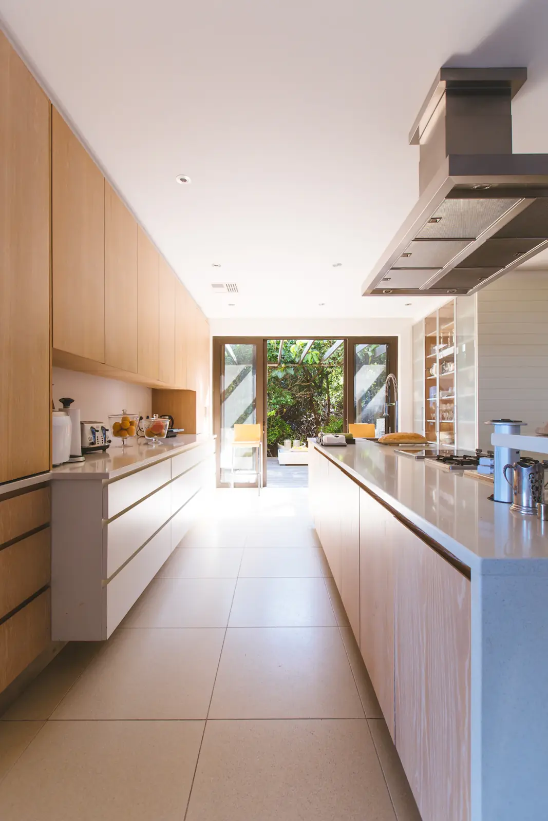 Galley kitchen with timber joinery and garden doors